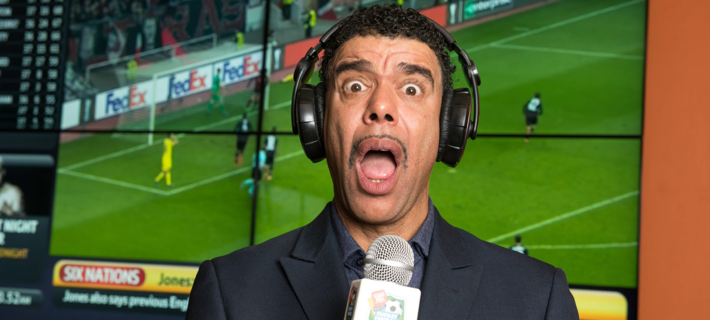 Chris Kamara in front of football match on TV for Flaming Grill