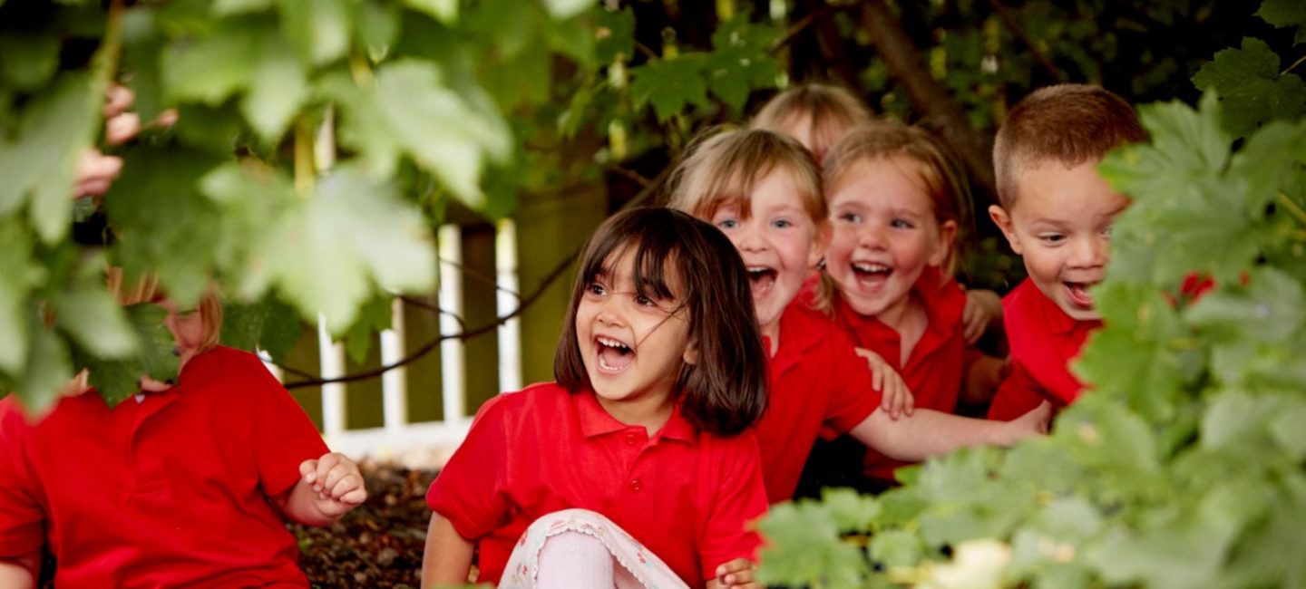 Children playing outdoors at Busy Bees nursery