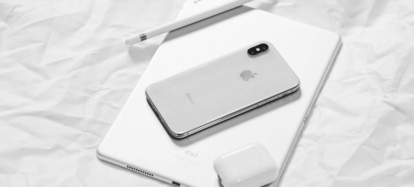An iPhone, iPad and Airpods