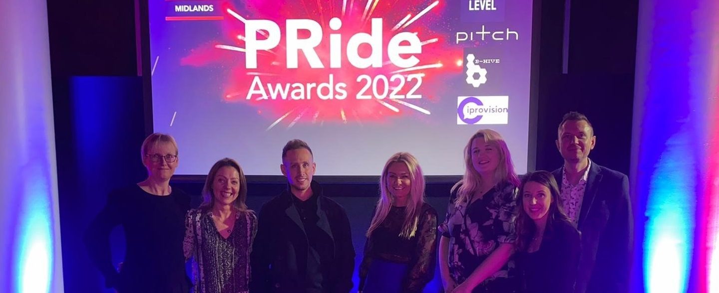 WPR team standing in front of PRide Awards sign