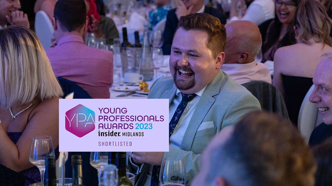 Gideon at awards ceremony with Young Professionals Awards logo