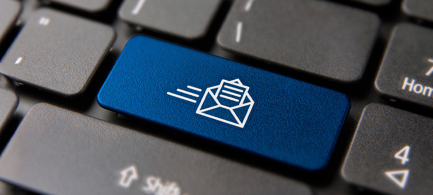 A computer keyboard with a blue LinkedIn newsletter button