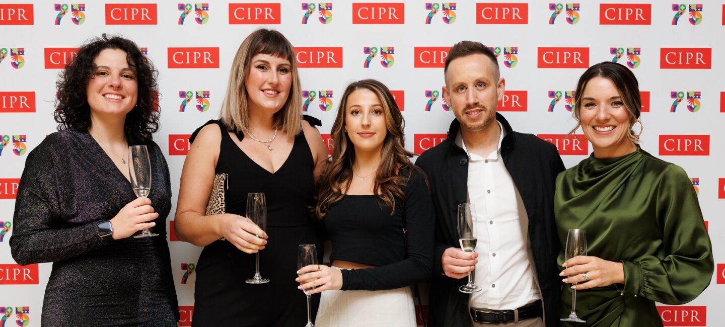 WPR colleagues in front of CIPR backdrop