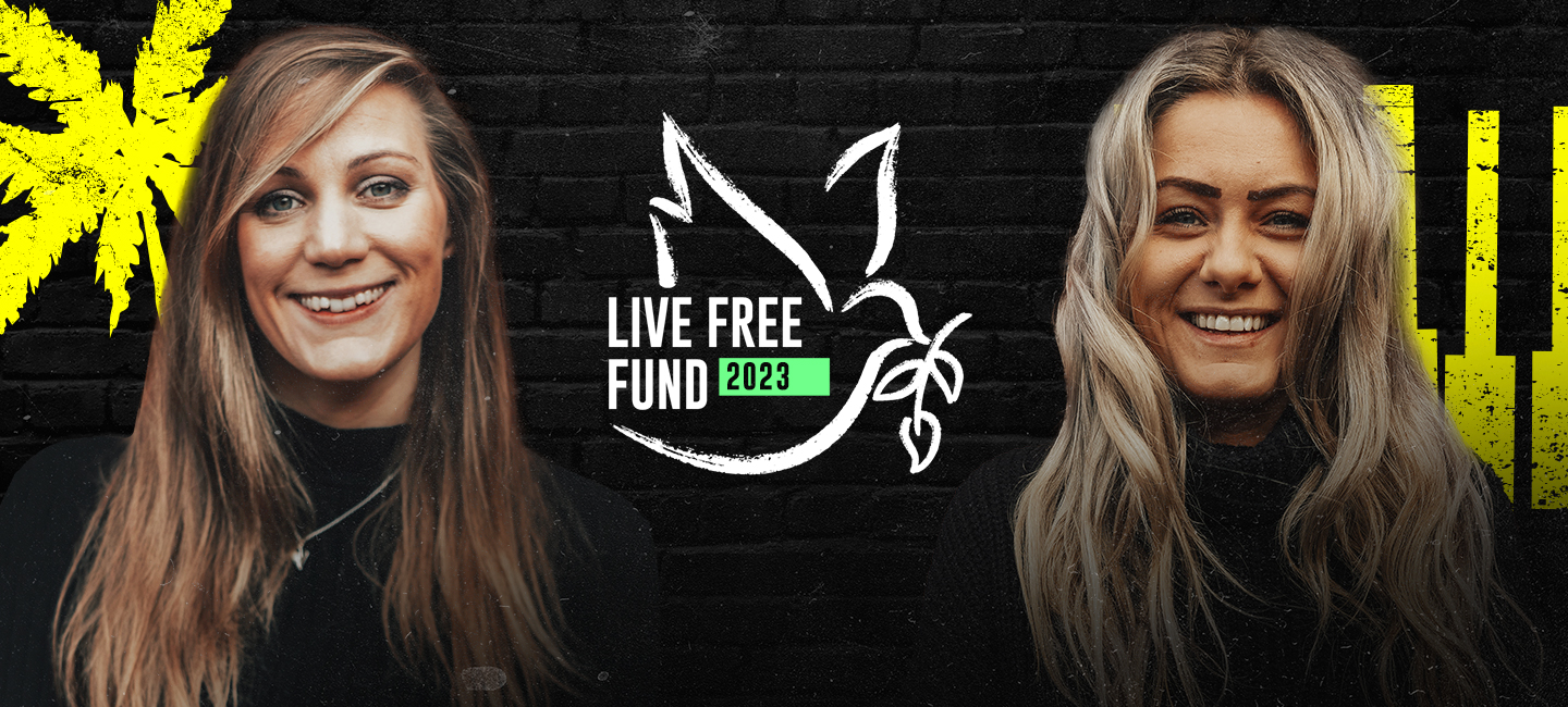 Alex and Nat smiling next to the Live Free Fund logo which is the outline of a white dove