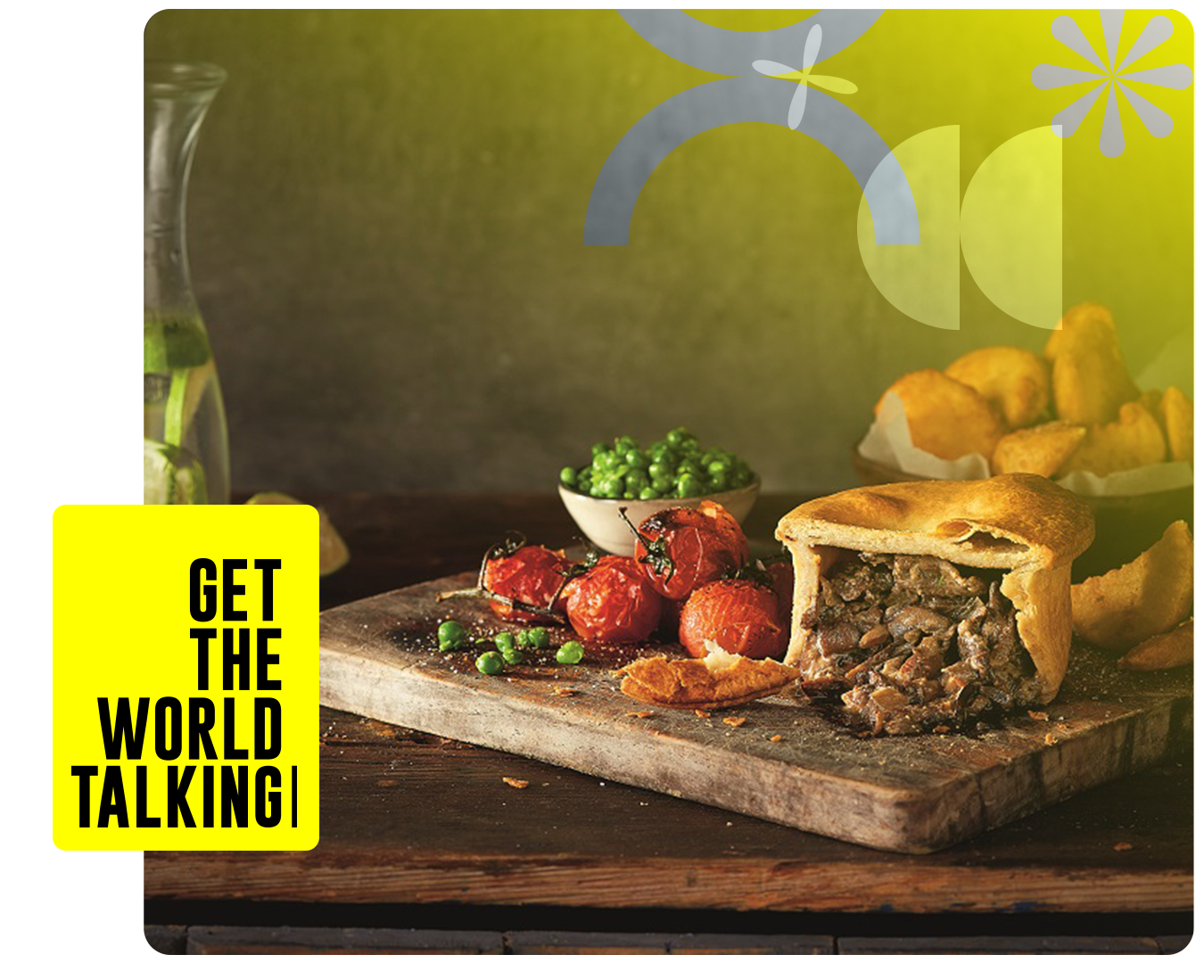 A pie and vegetables on a chopping board