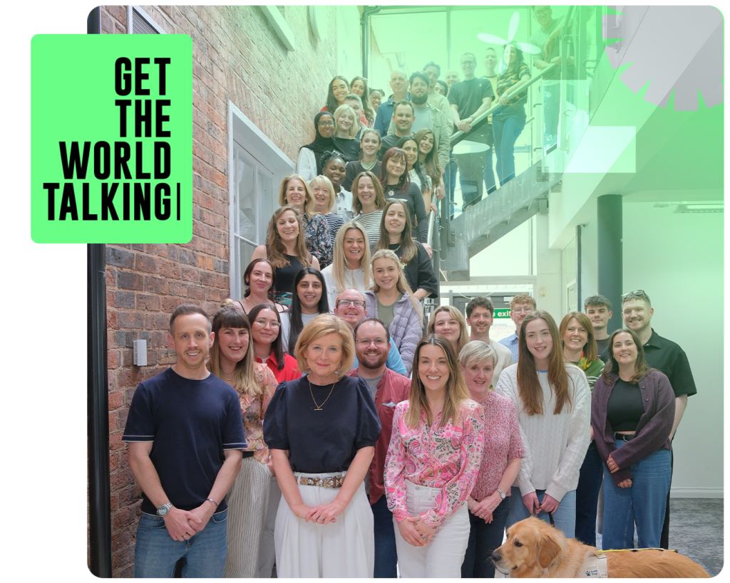 The WPR team standing on the office stairs and smiling